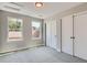 Comfortable bedroom with neutral walls, carpet, and closet, complemented by large windows and natural light at 3420 N Steele St, Denver, CO 80205