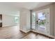 The entryway features a glass panel front door and sidelight, seamlessly connecting the interior with the outdoors at 3420 N Steele St, Denver, CO 80205