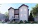 Modern two-story house with stylish siding, a balcony, and well-manicured landscaping at 3420 N Steele St, Denver, CO 80205
