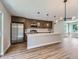 Well-designed kitchen with stainless appliances, spacious island, and ample cabinet space, perfect for cooking at 3420 N Steele St, Denver, CO 80205