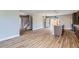 Spacious kitchen with eat-in island and stainless appliances seamlessly flows into the living area at 3420 N Steele St, Denver, CO 80205