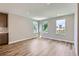 Living room bathed in natural light from three windows, creating a bright and airy atmosphere at 3420 N Steele St, Denver, CO 80205
