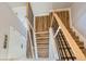 Stylish staircase with wood steps and black metal railings, offering a modern aesthetic at 3420 N Steele St, Denver, CO 80205