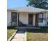 Charming white home featuring a covered porch and a well-maintained walkway at 150 Fulton Ave, Fort Lupton, CO 80621