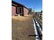 Spacious backyard with partial winter snow at 2003 Monte Vista Dr, Lochbuie, CO 80603