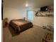 Cozy bedroom with carpeted floors, ambient lighting, and a comfortable bed at 2003 Monte Vista Dr, Lochbuie, CO 80603