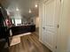 Spacious kitchen with dark wood cabinets, a breakfast bar, and stainless steel appliances at 2003 Monte Vista Dr, Lochbuie, CO 80603