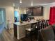 Well-appointed kitchen with a breakfast bar, granite countertops, and stainless steel appliances at 2003 Monte Vista Dr, Lochbuie, CO 80603