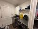 Functional laundry room with modern appliances and storage cabinets at 2003 Monte Vista Dr, Lochbuie, CO 80603
