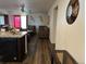 View of the living room with hardwood floors, modern decor, and natural light at 2003 Monte Vista Dr, Lochbuie, CO 80603