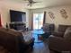 Inviting living room featuring modern decor, a large screen television, and comfortable seating at 2003 Monte Vista Dr, Lochbuie, CO 80603