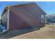 Partial view of home's side with yard at 2003 Monte Vista Dr, Lochbuie, CO 80603