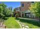 Enjoy this backyard with string lights, stone pathway, and a covered patio at 4258 Tennyson St, Denver, CO 80212