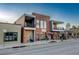 Charming brick building with inviting storefront, perfect for a restaurant with balconies at 4258 Tennyson St, Denver, CO 80212