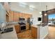 Modern kitchen featuring stainless steel appliances, stone countertops, and plenty of cabinet space at 4258 Tennyson St, Denver, CO 80212