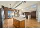 Modern open-concept kitchen with stainless steel appliances and a large center island, perfect for entertaining at 4258 Tennyson St, Denver, CO 80212