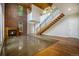 Loft style living room with exposed brick, modern staircase, and concrete floors at 4258 Tennyson St, Denver, CO 80212