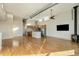 Open floor plan living room with modern kitchen and exposed ductwork at 4258 Tennyson St, Denver, CO 80212