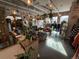 Inviting retail space with ample sunlight, clothing racks, decorative plants and a cozy seating area at 4258 Tennyson St, Denver, CO 80212