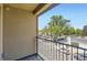 Apartment balcony overlooking the street with railing and exterior wall at 2700 E Louisiana Ave # 203, Denver, CO 80210