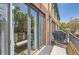 Private balcony with sliding glass door and space for seating at 2700 E Louisiana Ave # 203, Denver, CO 80210