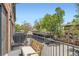 Outdoor balcony with a seating area overlooking parking space at 2700 E Louisiana Ave # 203, Denver, CO 80210
