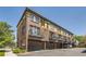 Multi-story brick building with parking, balconies, and a well-maintained exterior at 2700 E Louisiana Ave # 203, Denver, CO 80210