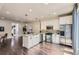 Open concept kitchen with stainless steel appliances and hardwood floors at 2700 E Louisiana Ave # 203, Denver, CO 80210