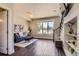 Cozy living room features dark wood floors, modern decor, and a staircase leading to the upper level at 2700 E Louisiana Ave # 203, Denver, CO 80210