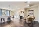 Open floor plan features dining space, fireplace, and breakfast bar to the modern kitchen at 2700 E Louisiana Ave # 203, Denver, CO 80210