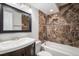 Basement bathroom with updated vanity and shower/tub combo at 3738 Rosewalk Ct, Highlands Ranch, CO 80129
