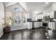 Modern kitchen featuring stainless steel appliances and dark tile floors at 3738 Rosewalk Ct, Highlands Ranch, CO 80129