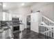 Spacious kitchen featuring stainless steel appliances, white cabinets, and easy access to the staircase at 3738 Rosewalk Ct, Highlands Ranch, CO 80129