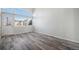 Spacious living room with large windows and wood-look flooring at 3738 Rosewalk Ct, Highlands Ranch, CO 80129