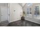 Bright room featuring a vaulted ceiling, large windows with shutters, and stylish gray floor tiles at 3738 Rosewalk Ct, Highlands Ranch, CO 80129