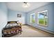 Inviting bedroom featuring natural light streaming through large windows, creating a serene and airy atmosphere at 13080 County Road 19, Platteville, CO 80651