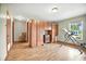 Spacious bonus room with hardwood floors, natural light, and plenty of storage, offering a versatile area at 13080 County Road 19, Platteville, CO 80651