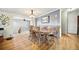 Dining room with table and seating for eight, and hardwood floors at 13080 County Road 19, Platteville, CO 80651