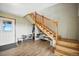 Inviting entryway features wood floors, staircase, and space for shoe storage at 13080 County Road 19, Platteville, CO 80651