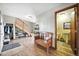This foyer features wood floors and stairs, access to a bathroom, and plenty of storage at 13080 County Road 19, Platteville, CO 80651