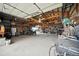 Large garage featuring an open layout, visible beams, and plenty of room for equipment at 13080 County Road 19, Platteville, CO 80651