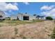 Exterior view of a large garage, perfect for storage or workshop space, complementing the property at 13080 County Road 19, Platteville, CO 80651