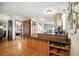 Open-concept kitchen with breakfast bar and hardwood floors at 13080 County Road 19, Platteville, CO 80651
