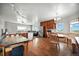 This kitchen features wood floors and plenty of kitchen island space for entertaining at 13080 County Road 19, Platteville, CO 80651