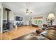 Living room with hardwood floors and corner wood burning stove at 13080 County Road 19, Platteville, CO 80651