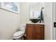 Stylish powder room featuring updated vanity and modern fixtures at 3379 Cranston Cir, Littleton, CO 80126