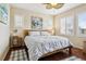 Serene bedroom with soft natural light, hardwood floors, and plush bedding at 3379 Cranston Cir, Littleton, CO 80126