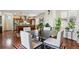 Elegant dining area adjacent to kitchen features modern table and chairs at 3379 Cranston Cir, Littleton, CO 80126