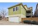 Two story home with a two car garage, small back deck, and fenced in yard at 3379 Cranston Cir, Littleton, CO 80126