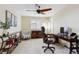 A home office featuring a ceiling fan, computer, and bookshelves at 3379 Cranston Cir, Littleton, CO 80126